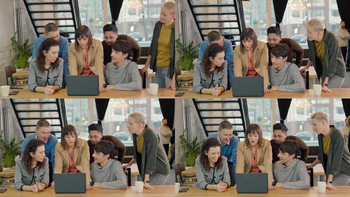 在充满活力的创业公司办公空间里，多元化的团队在笔记本电脑上合作。