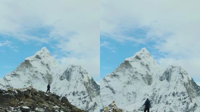 徒步旅行者在看Ama Dablam山。尼泊尔的喜马拉雅山脉。鸟瞰图。垂直视频