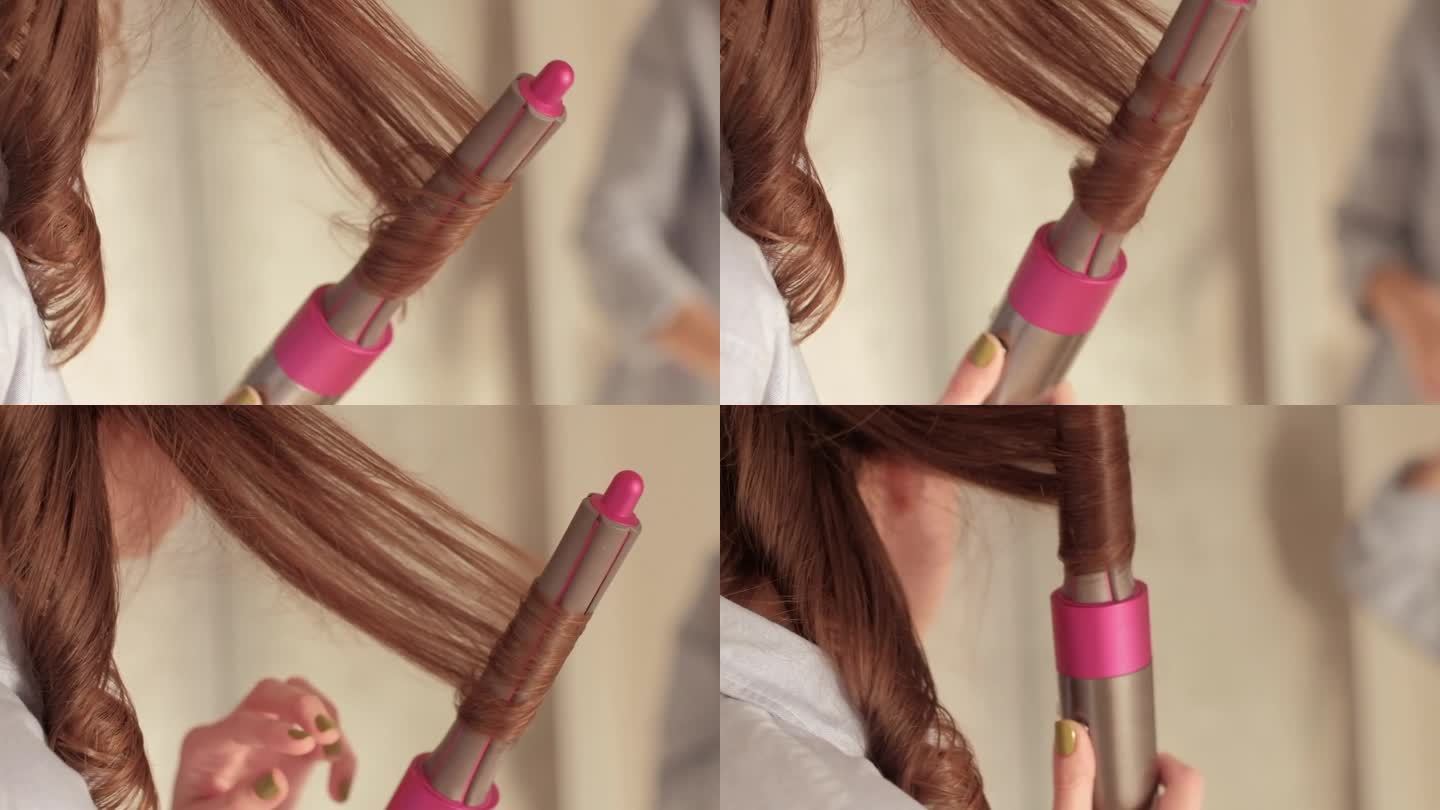 一头卷发的黑发女人，用粉红色的卷发棒把一缕头发卷起来