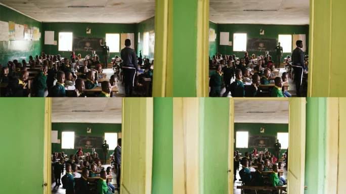 学生们在教室里挥挥手，向摄影师道别。农村一所教育大楼的内部。受教育权