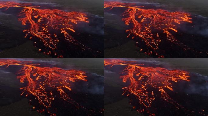 2023年冰岛火山喷发的分支熔岩流，炽热的红色岩石从地下喷发出来，岩浆河，自然界罕见的镜头，独特的地