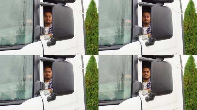 印度卡车司机坐在驾驶室里的画像
