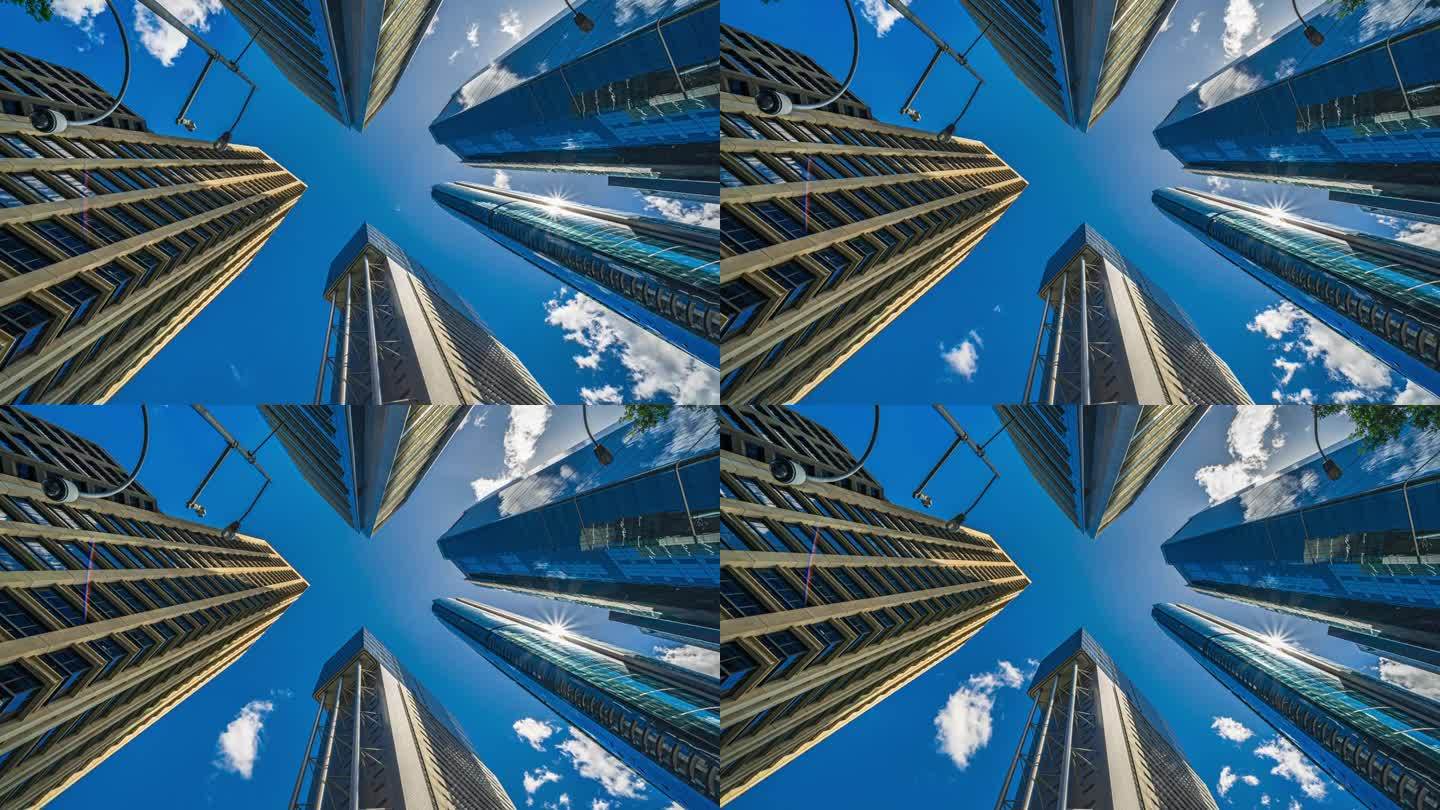 澳大利亚昆士兰州布里斯班中央商务区，低角度拍摄的高层企业大楼和大楼中心的摩天大楼与云层的反射