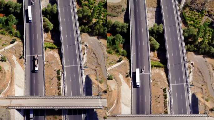鸟瞰图:高速公路盘山而过，设有隧道、高架桥。山间公路与隧道和高架桥，航拍。山区公路，隧道和高架桥鸟瞰