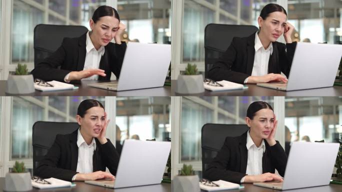 讨厌的女性自由职业者坐在桌子上，用现代笔记本电脑工作，却错过了办公室的截止日期。惊慌失措的黑发白人在