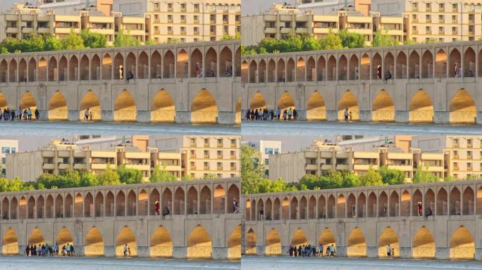 伊朗，伊斯法罕——2022年5月:人们走在33个拱门的SioSe Pol桥上，这是伊斯法罕最古老的桥