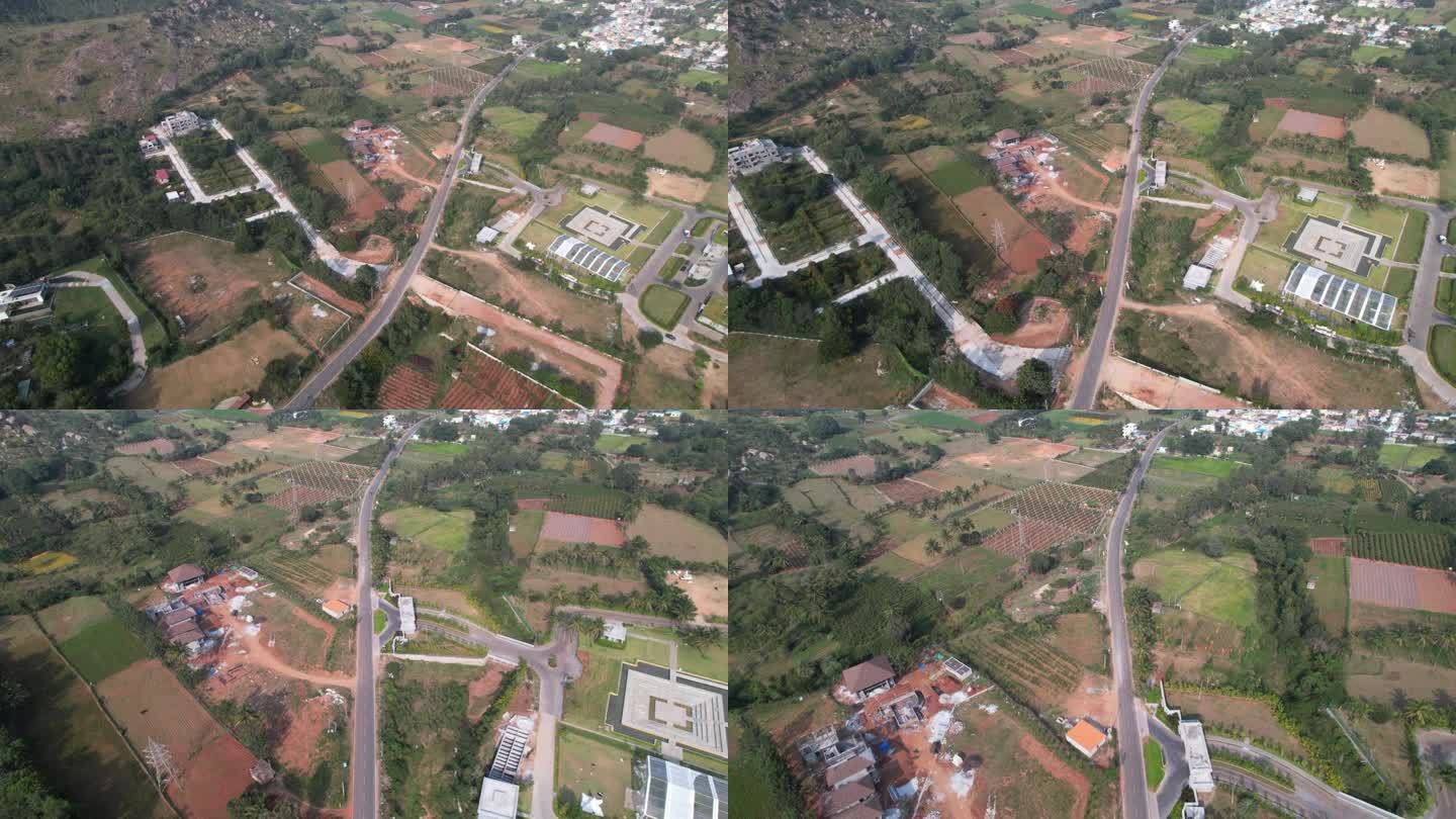 班加罗尔郊区附近正在开发的一个新的卫星城的航拍画面展示了农业用地是如何被转化为城市化的，这导致了森林