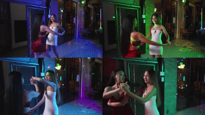 两个女人在充满活力的拉丁酒廊跳巴恰塔舞