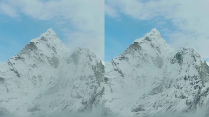 楠格曾山顶上的男子望着阿玛达布拉姆山。尼泊尔的喜马拉雅山脉。鸟瞰图。垂直视频