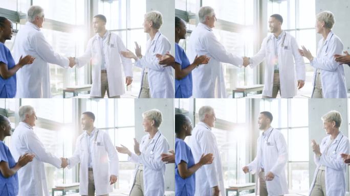 在医院诊所开会、鼓掌或医生握手表示成功、好工作或晋升。集体鼓掌，祝贺或自豪的医护人员握手表示团队合作