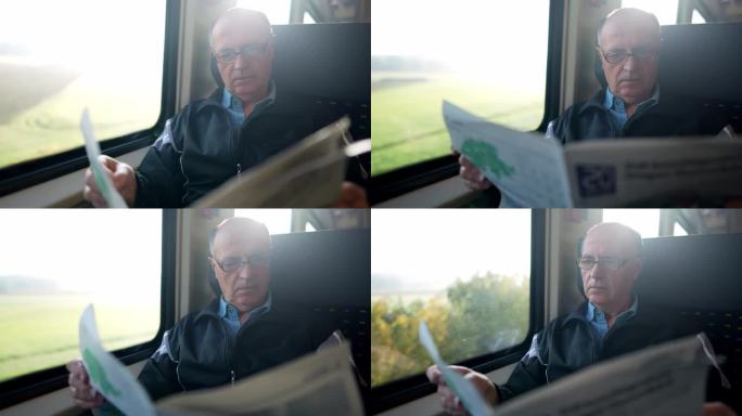 老人在火车上看报纸