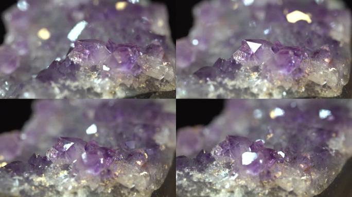 闪亮的紫水晶带有旋转的内含物，近距离观察，石英晶体纹理抽象的背景