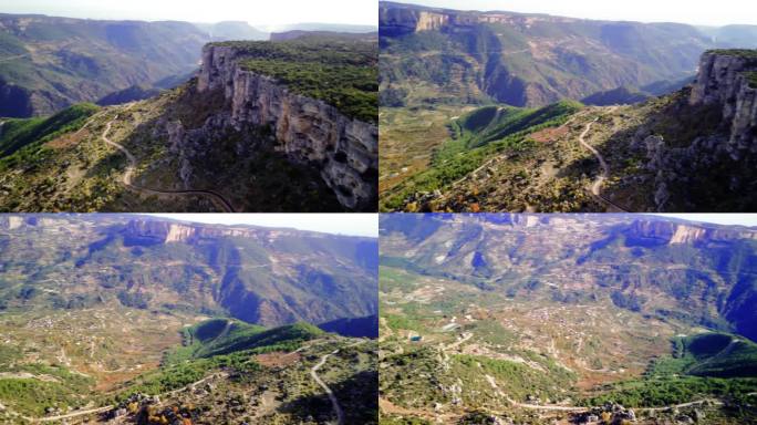 全景峡谷峭壁，绿色森林。峡谷、峡谷在山脉旅游中颇具吸引力。巨大的山地峡谷，峡谷在野生森林中。旅游中峡