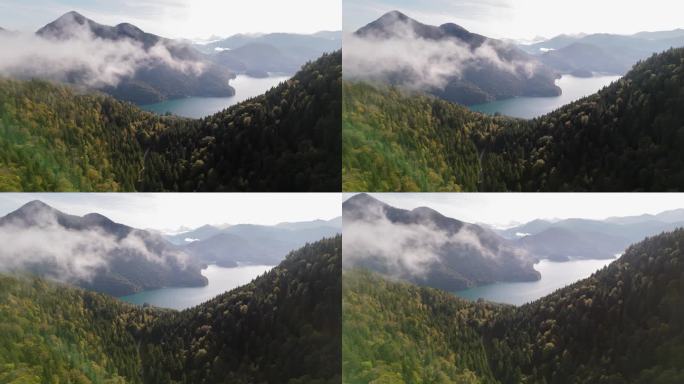 雾在运动越过天际线以上的风景如画的山阿尔卑斯山和水