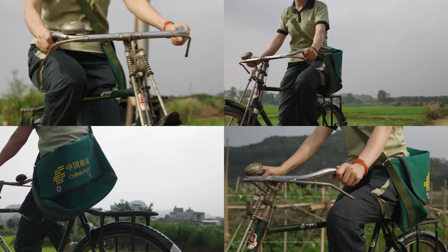 中国邮政快递员在乡下辛苦的骑自行车送快递