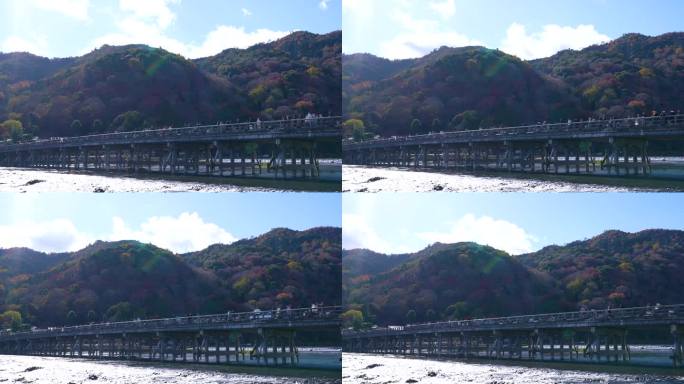 延时摄影:行人和游客穿过日本京都岚山的通津桥