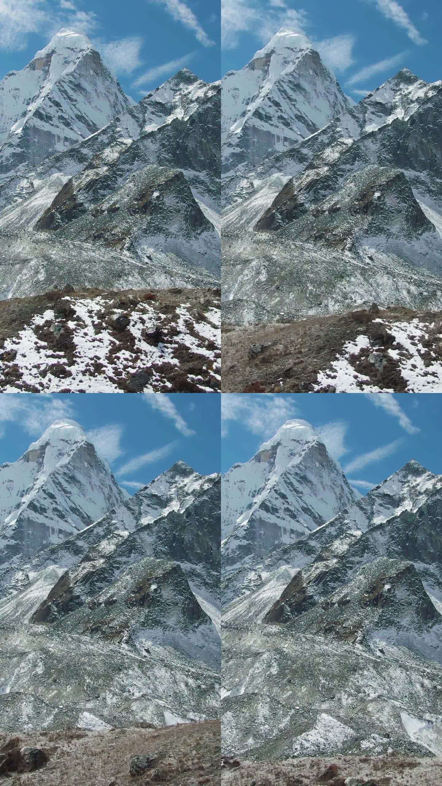 Ama Dablam山和徒步旅行者。尼泊尔的喜马拉雅山脉。鸟瞰图。垂直视频