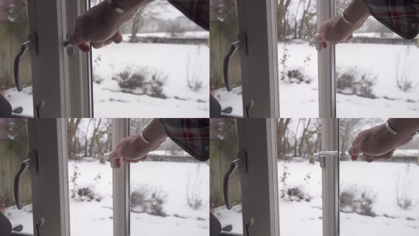 在下雪天用手打开窗外的Espag手柄，室内视野-中等