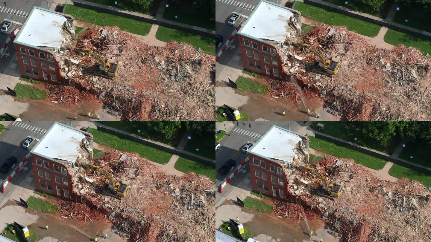 肯塔基州伯里亚历史悠久的爱德华兹大厦拆迁现场。液压破碎机挖掘机拆除旧建筑砖墙