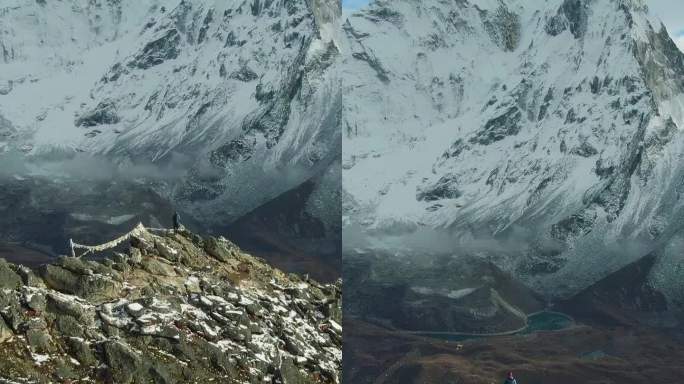 南嘎曾山和阿玛达布兰山山顶上的徒步旅行者。尼泊尔。鸟瞰图。垂直视频