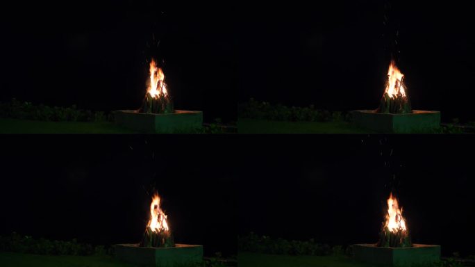 混凝土壁炉旁的篝火，燃烧的木棍，实时拍摄