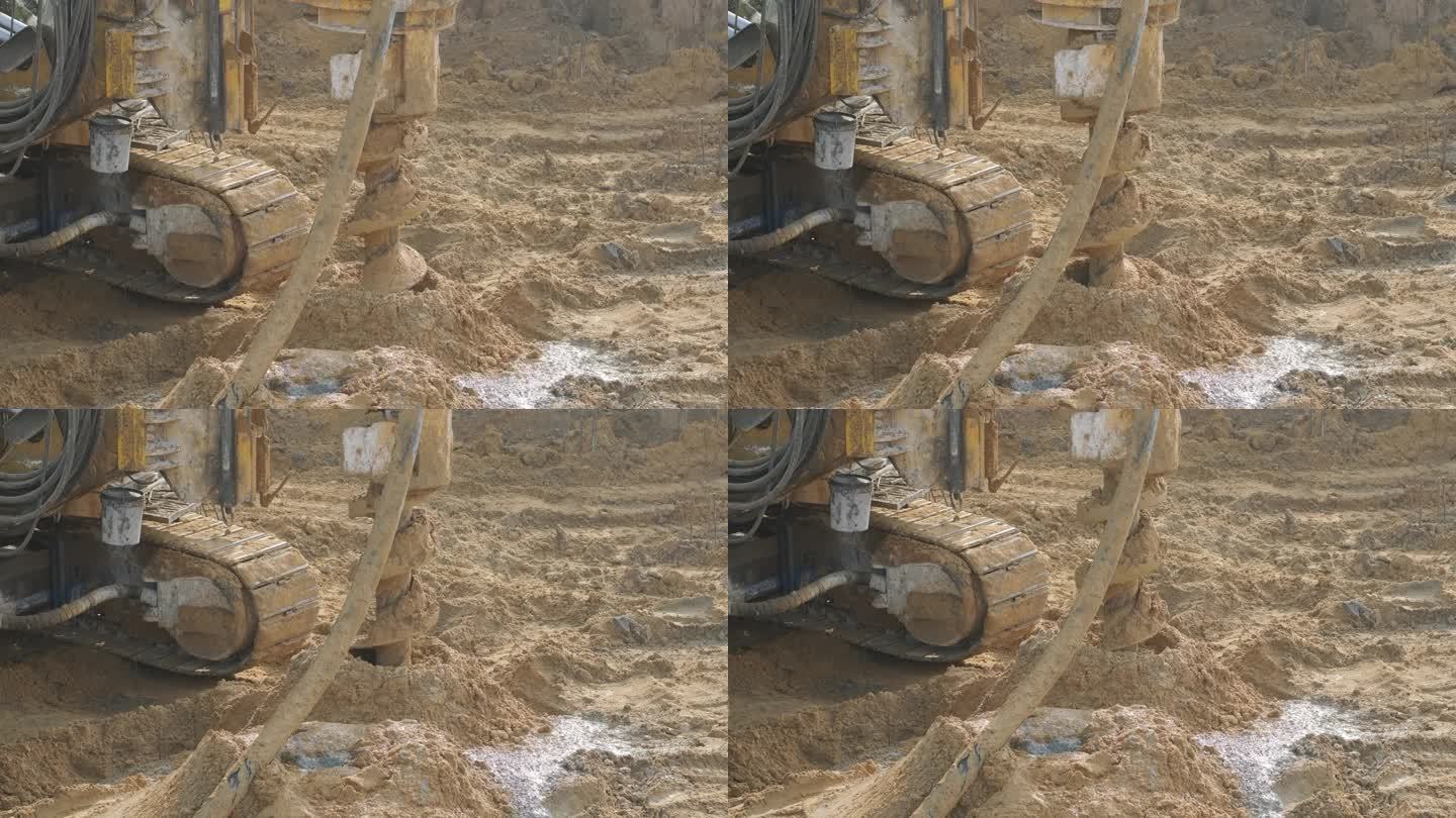 在地面上安装桩的设备，在建筑基础铺设中进行掘进柱的重型机械。施工鸟瞰高度。施工现场钻孔桩基础。