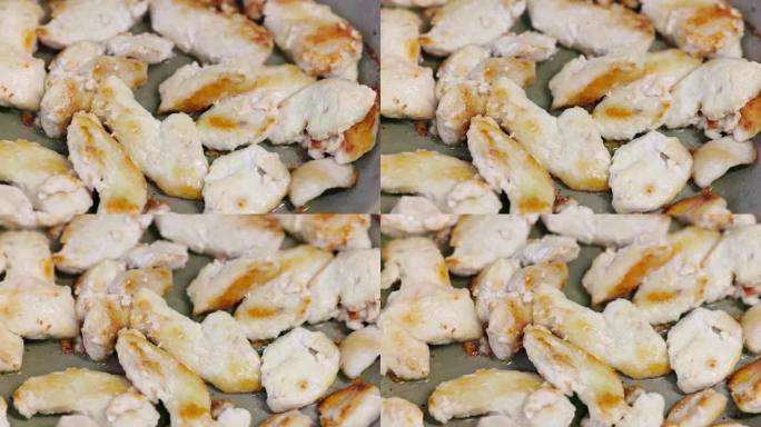 鸡胸肉在油锅上煎炸，近距离慢动作全画幅背景，选择性对焦和浅景深