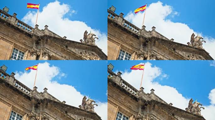 西班牙国旗被风吹在建筑的屋顶上——圣地亚哥孔波斯特拉地方政府办公室