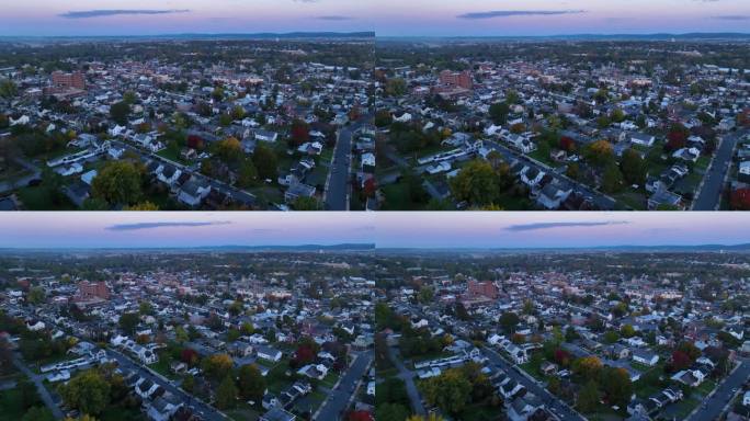 美国城镇秋天黎明日出时的广角航拍照片。距离主街不远的房屋和社区。