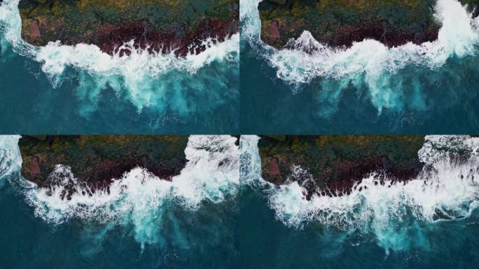 海浪飞溅的岩石海岸顶视图。惊人的泡沫冲浪撞击海滩