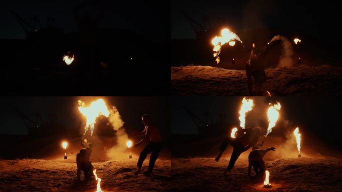 火的杂技表演，两个杂技演员在火上跳跃和空翻