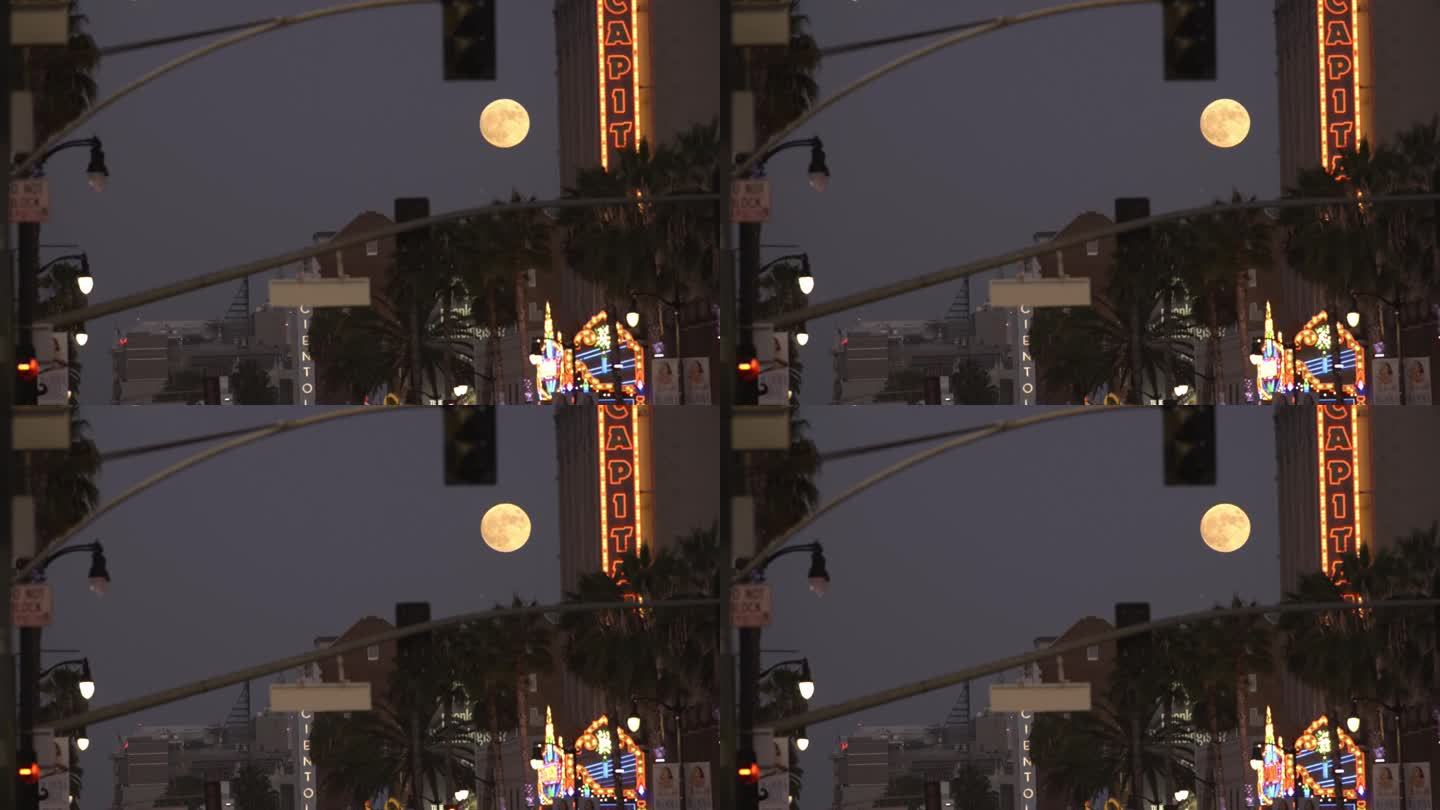 洛杉矶好莱坞的满月。加州洛杉矶夜晚的城市灯光