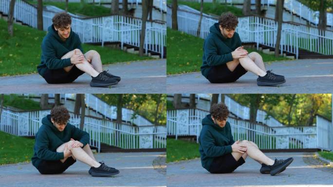 户外活动前，运动员坐在地上伸展膝盖、腿部、肌肉。真正的时间。一个人在锻炼前按摩膝盖和肌肉。