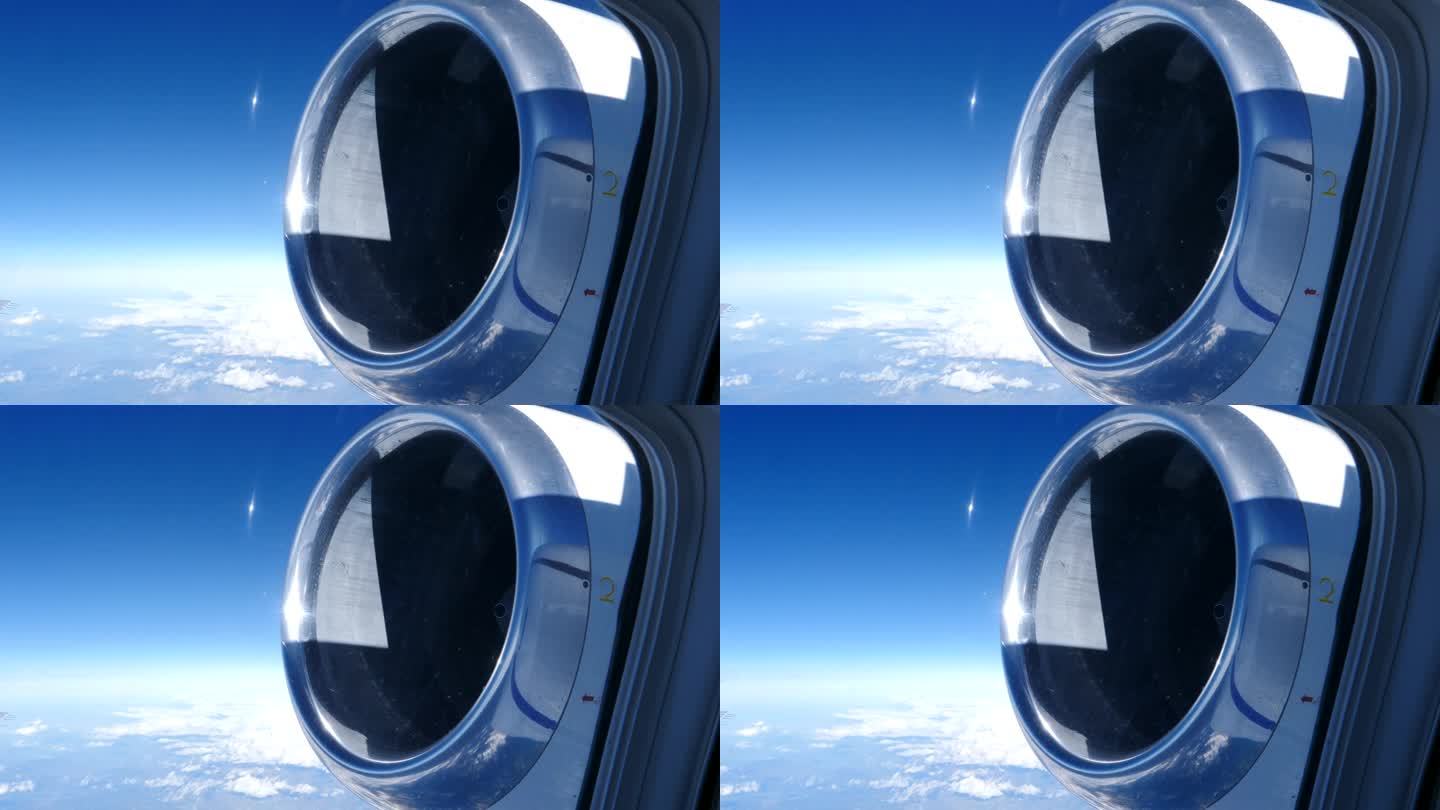 从飞机乘客窗口看后置涡扇喷气发动机