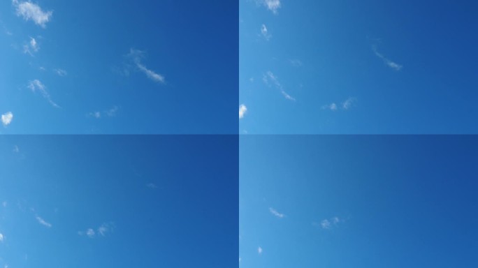 4K延时美丽的蓝天与轻云的背景。自然的夏日天空。细腻的色调勾勒出宁静的氛围。天气一天。飘渺的云。航空