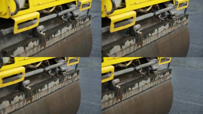 用串联式压路机对沥青路面进行压实、压实、平整、平整的道路基础设施沥青浇筑过程