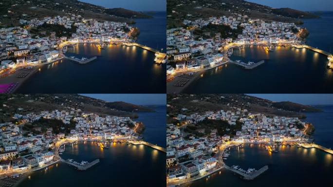 黄昏时分，希腊基克拉迪群岛安德罗斯岛，空中无人机拍摄的Batsi村，有传统的小酒馆和清澈的海水海滩