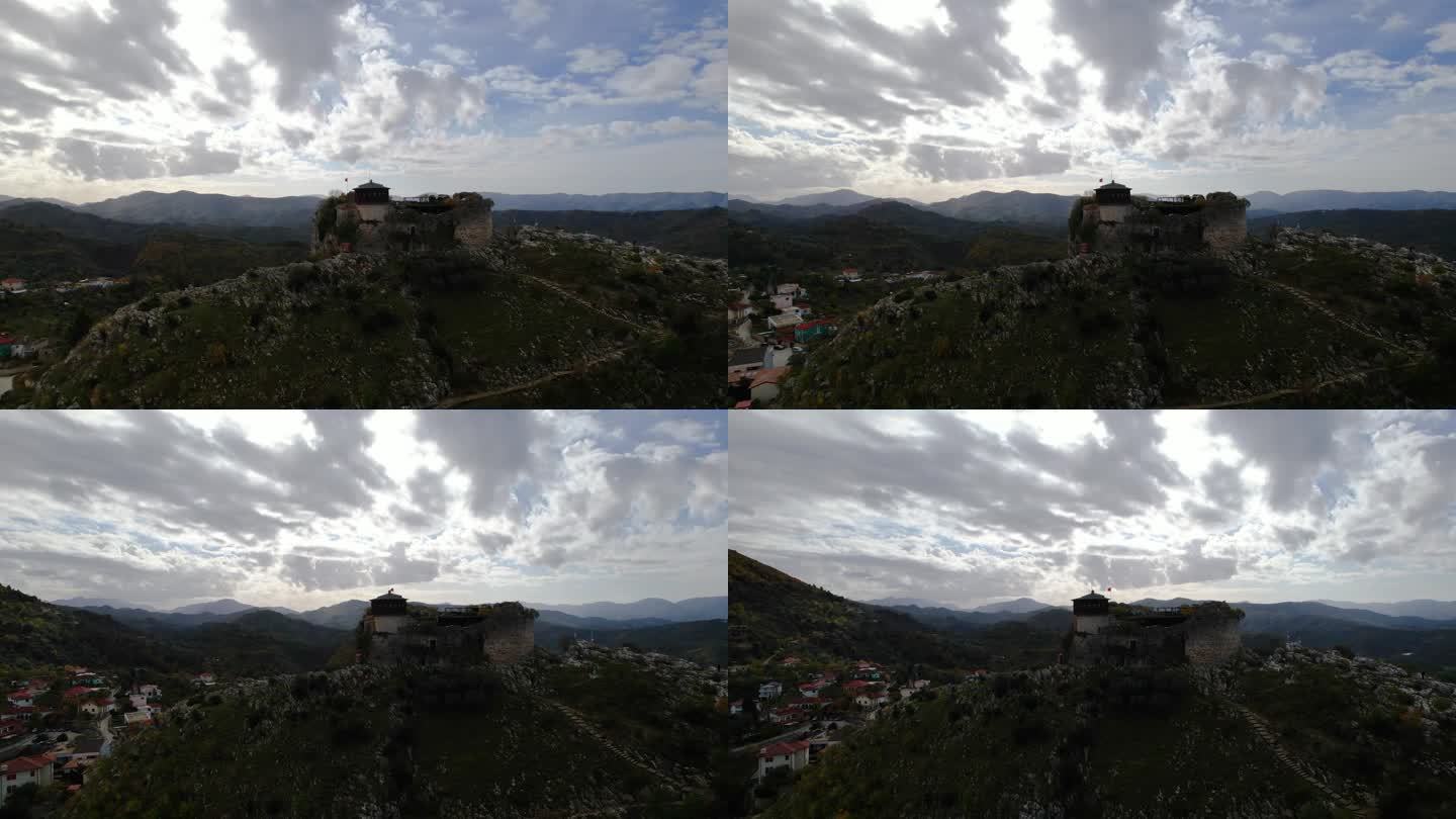 史诗要塞:古老的佩特雷拉城堡，一个永恒的战场，坐落在岩石山上，在戏剧性的天空和阴沉的云