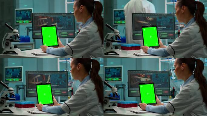 科学家手持绿色色度键屏的平板电脑