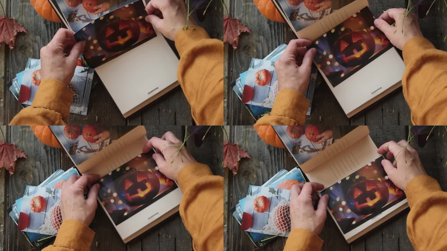 女性双手将秋天的照片印进相册。