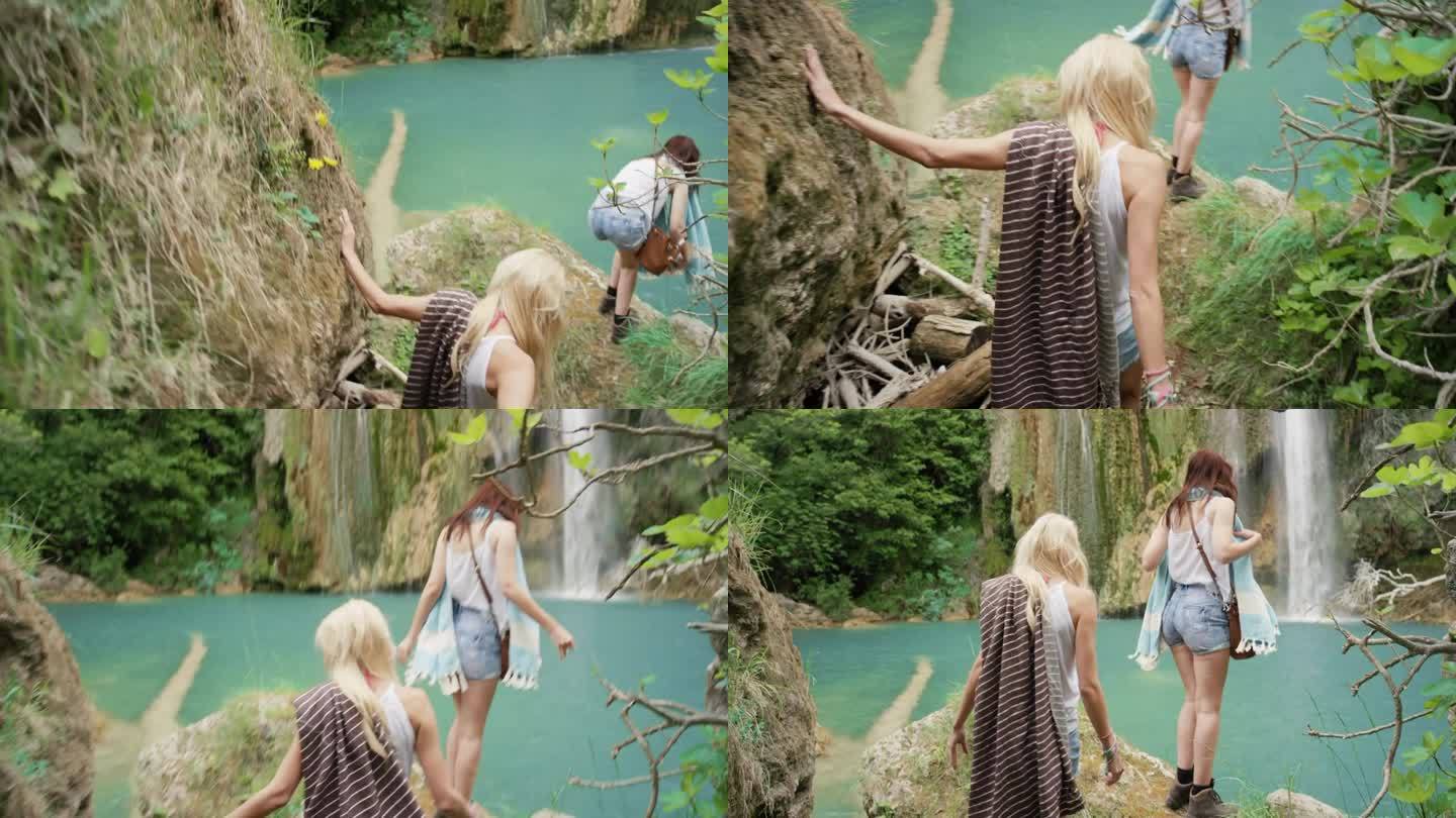 年轻女子发现隐藏瀑布的秘密举起双臂庆祝在自然池塘里的野生游泳冒险最好的朋友，在大自然中享受无忧无虑的