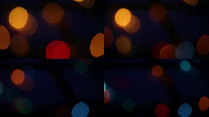 抽象背景闪烁的节日花环的不同颜色在晚上。