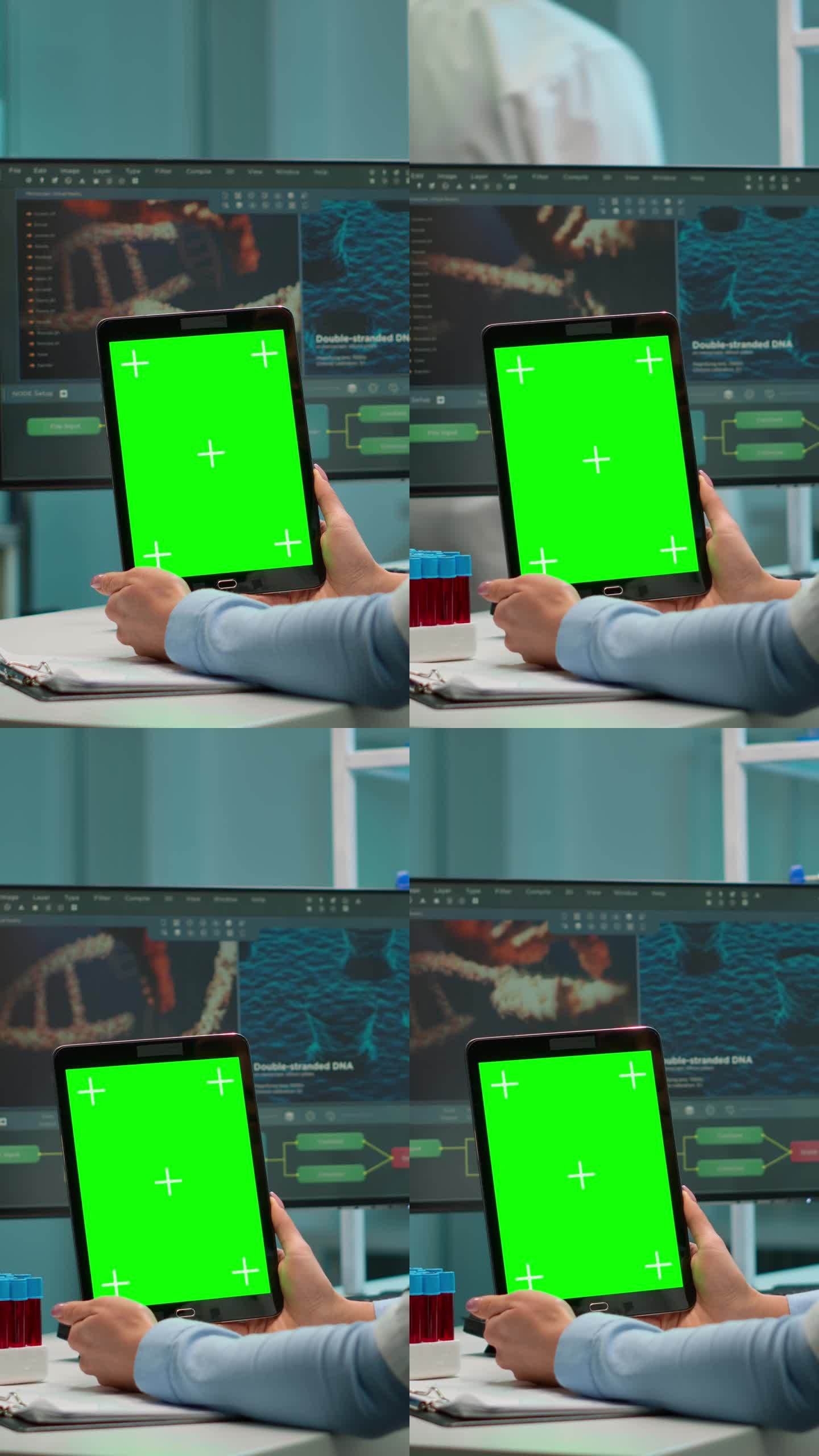 垂直视频:科学家手持绿色色度键屏的平板电脑