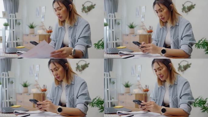 亚洲女性使用智能手机支付非接触式支付和银行应用程序支付在线水电费支付，网上银行技术和汇款。