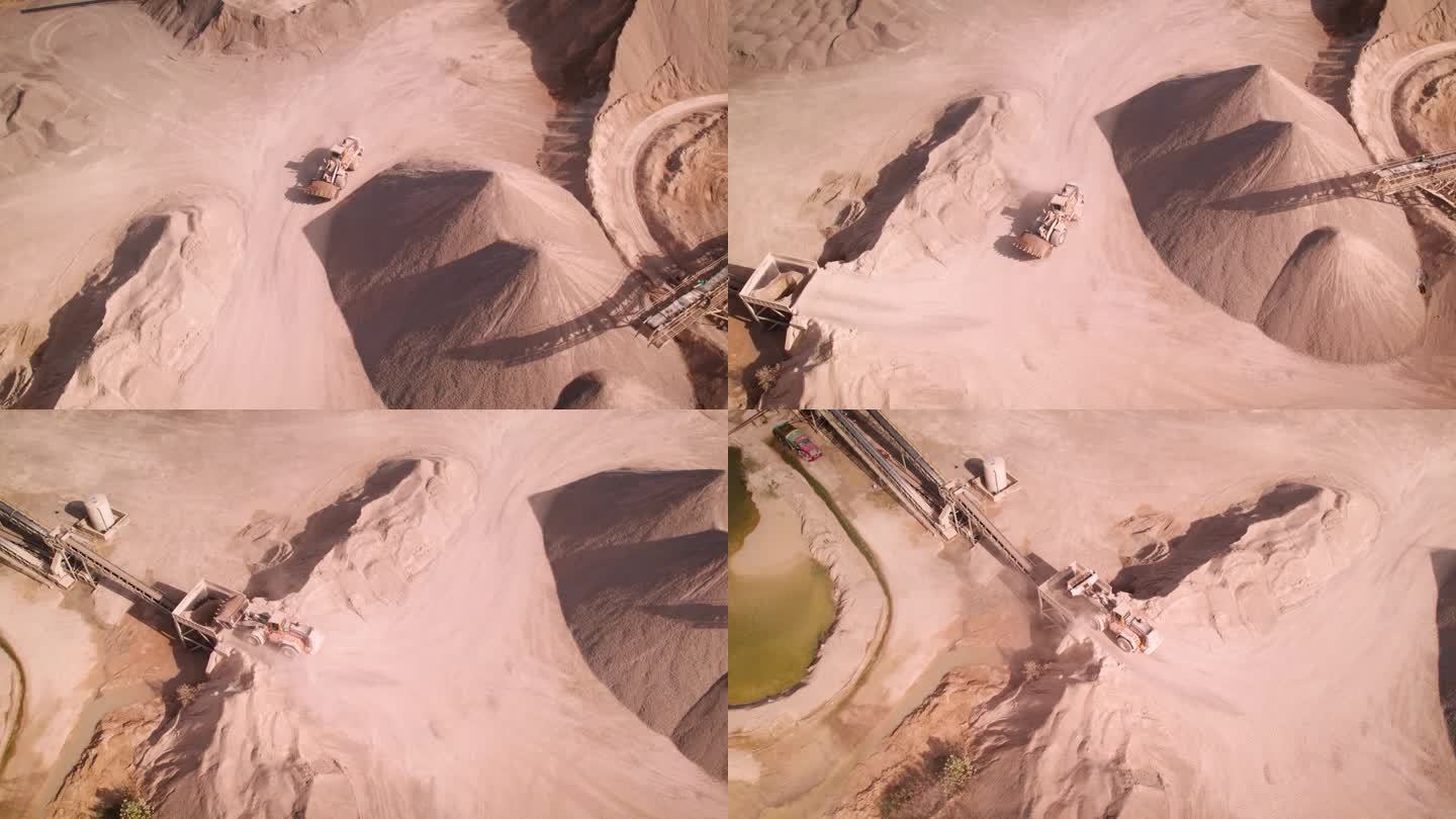 无人机拍摄的一架推土机在美国一个沙矿的大型洗砂机中卸载沙子的画面