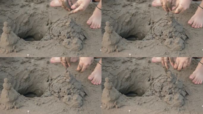 暑假期间想在沙滩上用沙子堆沙堡的孩子，和父母一起玩得很开心的慢镜头特写