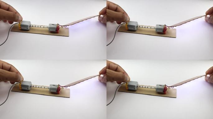直流电动机及其轴连接。当电源提供给一个电机时，LED面板发光，显示能量转换的概念