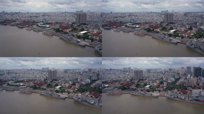 航空轨道拍摄的内河港口与海军舰艇和旅游船。