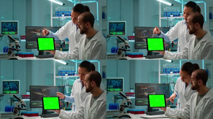 专业化学家在使用色度键屏的平板上工作
