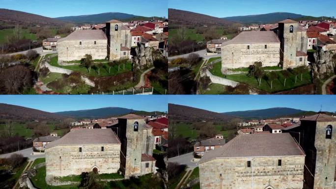 无人机在西班牙卡斯蒂利亚莱昂Canicosa de la Sierra村的一座老教堂上空飞行。